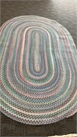 58x96 braided rug, pink and blue, has mark