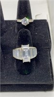 Pair of unmarked CZ silver tone rings sizes 8 & 10