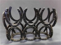 Welded Horseshoe Magazine Rack ??