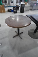 1-small round table with wood finished top