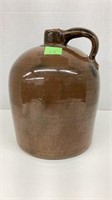 Vintage stoneware whiskey jug with cork.
