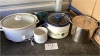 Three slow cooker crockpots, stainless pot with