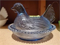 Blue glass laying hen