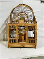wood bird cage with carved flowers