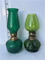 2 small green oil lamps