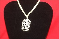 A Chinese Bone Necklace and Pendant