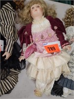 22.5 " PORCELAIN COLLECTOR DOLL W/ PINK DRESS