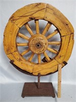 Old Wagon Wheel on Iron Display Stand