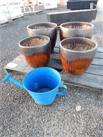 Large flower pots and a watering can