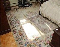 Lot of 2 sculpted wool area rugs. Largest measures