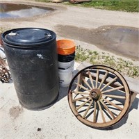 40 gallon drum, 5 gallon pails, bench & old wheel