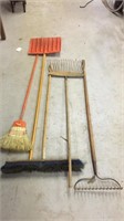 rakes, brooms, and shovel