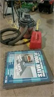 Small shop vac, floor mats, gas can and stand