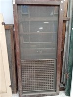 >Wood screen door with bottom metal grate