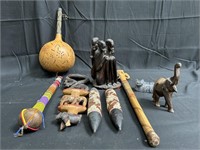 Group of wood carvings & one stone carving