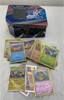 Pokemon tin with cards