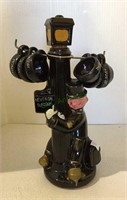 Vintage liquor decantor drunk on lamp post with