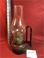 Oil lamp in metal holder