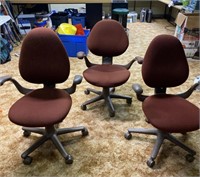 Set of three Red Rolling Office Chairs
