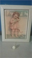 Musical frame with little girl holding doll