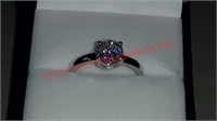 SILVER TONED RING WITH LARGE CUBIC ZIRCONIA CENTER