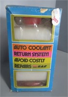 Auto coolant return system.