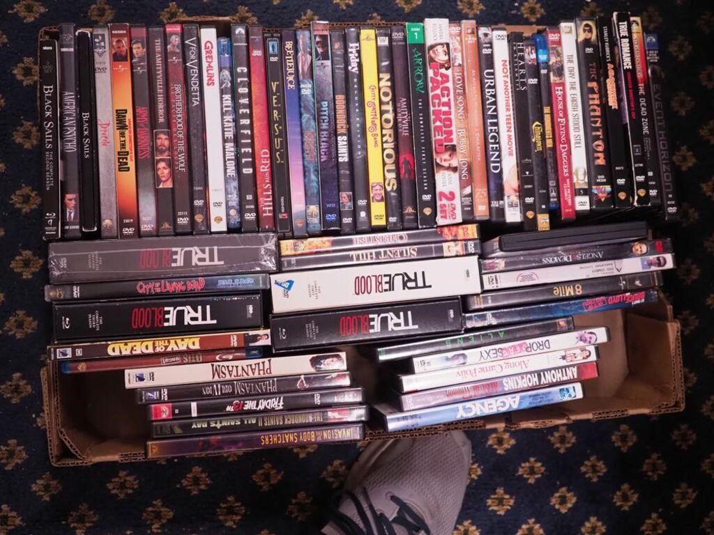 A box of DVD movies