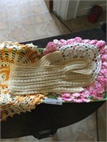2 doilies and crocheted ladies gloves
