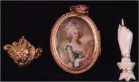 A Victorian locket with portrait of woman with