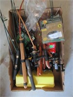 Large lot of ice fishing poles and equipment.