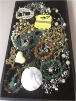 Tray lot of assorted costume jewelry. Tray not