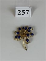 BOUCHER GOLD TONE FLOWER PIN WITH BLUE STONES