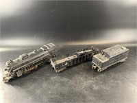 Box with 3 Lionel train cars and a miniature mine