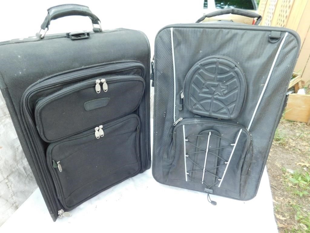 Pair of travel suitcases with wheels