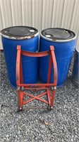 2 plastic barrels and cart