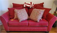 RED UPHOLSTERED LOVE SEAT