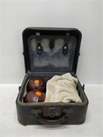 set of 4 vintage bowling balls in carrying case