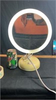 Lighted magnifying makeup mirror