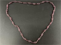 Polished garnet bead necklace with unique beading