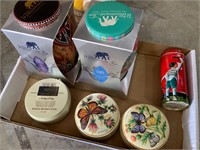 box lot of tea and chocolate tins unopened