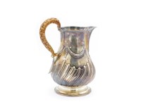George III silver rococo milk jug
