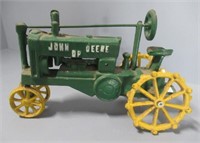 Cast John Deere tractor. Measures: 7" H x 11" W.