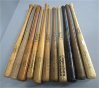 Miniature wood baseball bats.