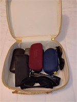 Case with sunglasses and eyeglasses.