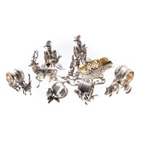 Six silver plated figural  napkin ring holders