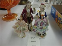 Three small Capodimonte porcelain figures.