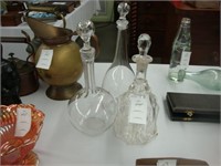 Three old crystal decanters.