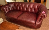 Excellent leather burgundy curved back couch