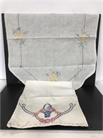 Two vintage embroidered table linens
