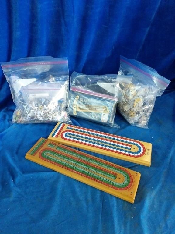 A puzzle and games lot that includes puzzle
